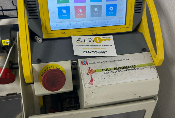 All in 1 Locksmith key cutting machine with a touchscreen interface displaying menu options is placed on a white surface.