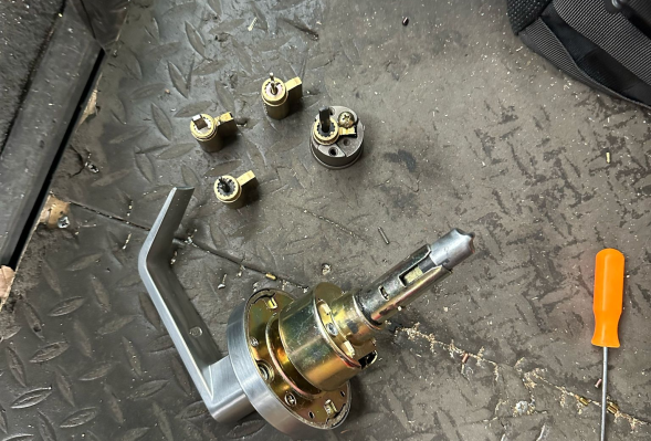 All in 1 Locksmith performing door lock repair
